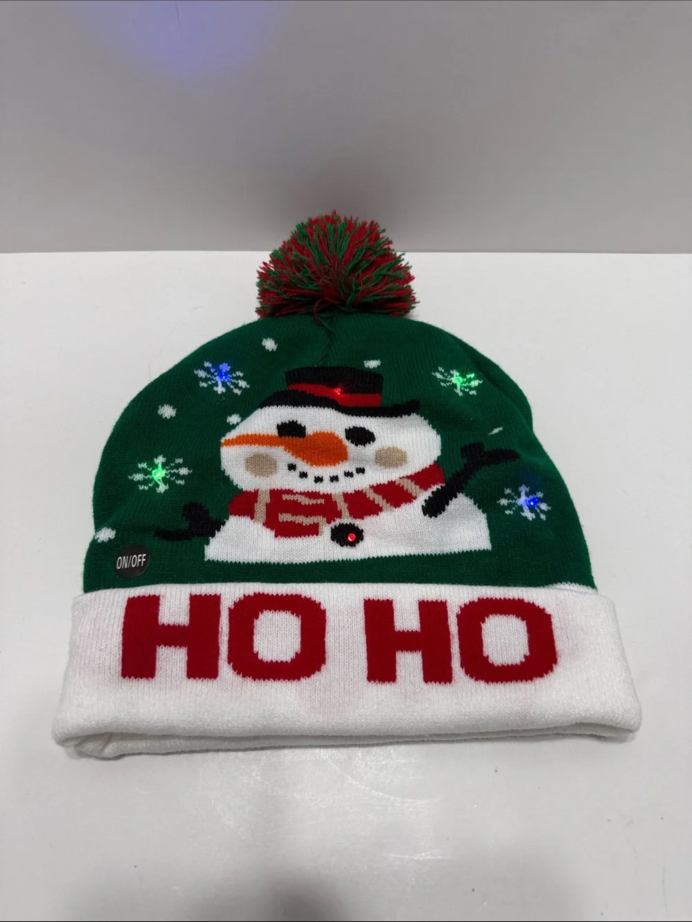 Green Holiday Light Up Snowman Pom-Pom Beanie Hat with 'HO HO' Cuff